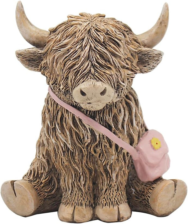 The Leonardo Collection Happy Highland Cow - Fashion Icon - Highland Cow Sitting with Handbag Figurine, LP73653