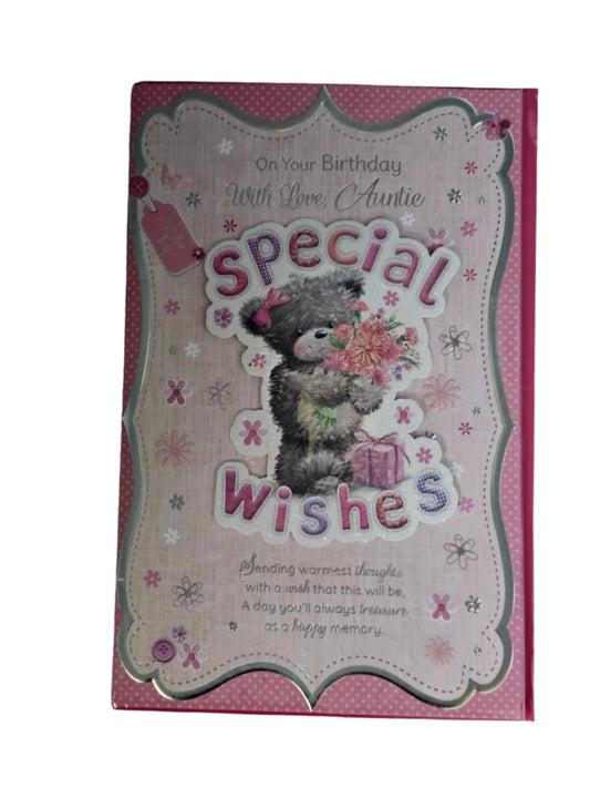 A colorful birthday card with a teddy bear holding a gift and flowers, with text that reads 'Special Wishes' and 'With Love Auntie'.